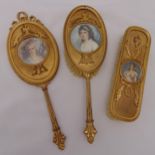 A French gilded metal dressing table set with polychromatic prints of miniature portraits to include