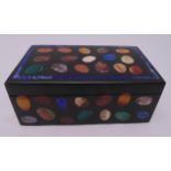 A black marble rectangular box the sides and the pull off cover inlaid with malachite and lapis, 9.5