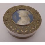 A French 19th century tortoiseshell circular snuff box, the pull off cover with a miniature portrait