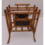 A bamboo rectangular magazine rack with floral side panels and central carrying handle, 50 x 39 x