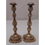 A pair of hallmarked silver table candlesticks of knopped baluster form, London 1929, approx total