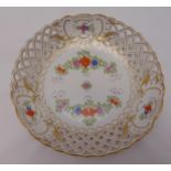 A Meissen circular dish with pierced sides decorated with flowers and leaves, 24cm (d)