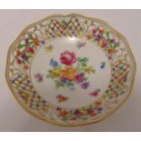 A Dresden pierced dish decorated with flowers and leaves, marks to the base, 16.5cm (d)