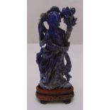 A Chinese lapis lazuli carved figurine of a female figure on triangular hard wood stand, 16cm (h)
