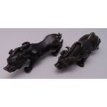 A pair of Chinese bronze dragon figurines, 36.5cm (w)