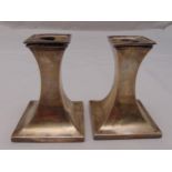 A pair of Art Deco style hallmarked silver table candlesticks of waisted rectangular form, Sheffield