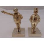 A pair of hallmarked silver Victorian pepperettes in the form of Dickensian figures on striated