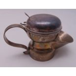 A Victorian hallmarked silver shaving mug of customary form with double scroll handle, the domed