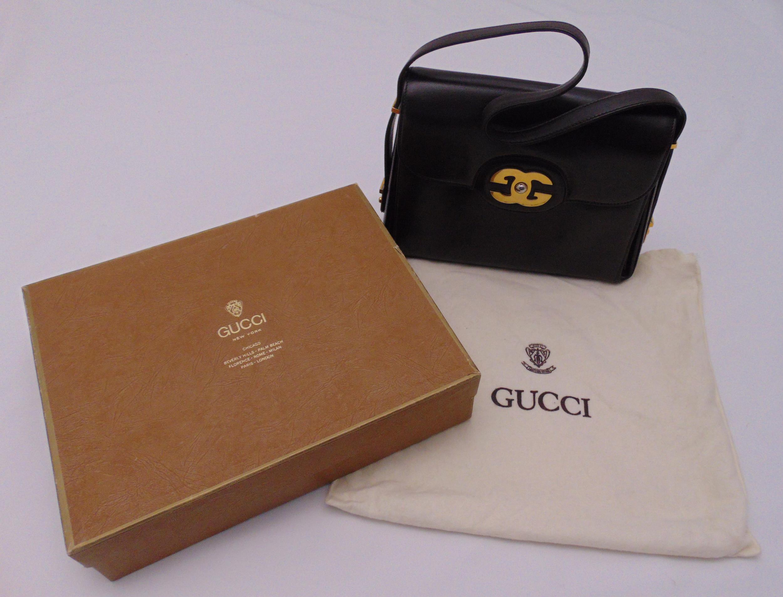 Gucci 1960s brown leather ladies handbag with initialled clasp and shoulder strap, in original