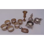 A quantity of hallmarked silver to include a Kiddush cup, condiments, six napkin rings and a wine