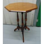 A 19th century mahogany occasional table, octagonal top, three cylindrical supports on scroll