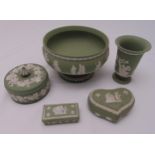 Wedgwood green Jasperware to include covered boxes, a vase and a fruit bowl (5)