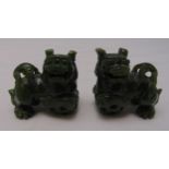 A pair of oriental carved jadeite dogs of foe, each 2 x 5 x 3cm