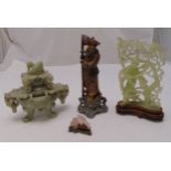 A quantity of carved oriental soapstone figurines to include an incense burner (4)