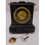 An early 20th century rectangular black marble mantle clock, rectangular the dial with Roman