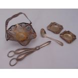 A quantity of hallmarked silver to include a bonbon dish, grape scissors, two ashtrays and a cream