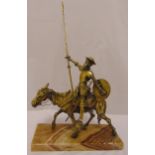 A brass figural group of Don Quixote and Rocinante mounted on a rectangular onyx base, 52 x 32 x