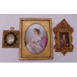 A framed painted miniature of Napoleon, a framed painted porcelain panel of Empress Eugenie and a