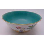 A Chinese famile rose bowl decorated with figures, animals and turquoise wash to centre, 8cm (h)
