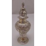 A Goldsmiths and Silversmiths pear shaped hallmarked silver sugar sifter, chased with flowers and