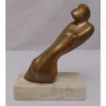 Edward Walsh bronze figurine of a reclining female figure signed to the base, mounted on a white