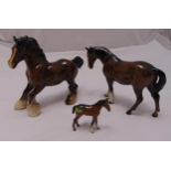Three Beswick figurines of horses of varying size, tallest 20cm (h)
