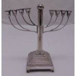 A hallmarked silver Menorah on stepped square base with beaded borders, A/F, approx total weight