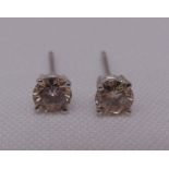 A pair of 9ct white gold and diamond stud earrings, approx total weight 1.2g