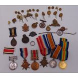 A quantity of military medals, badges and buttons to include a Victorian South Africa medal with