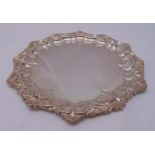 A Victorian hallmarked silver card tray, circular with shell and floral border, Sheffield 1895,