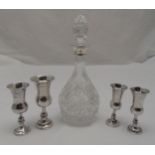 Four hallmarked silver Kiddush cups and a cut glass decanter with drop stopper and silver collar (