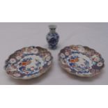 Two Chinese plates decorated with flowers and leaves and a blue and white vase, marks to the base,