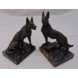 A pair of spelter figurines of dogs in various poses on square marble bases, tallest 20cm (h)
