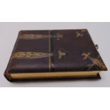 A Victorian leather bound photograph album to include monochromatic photographs, 21 x 14cm
