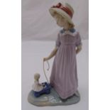 Lladro figurine of a little girl with a doll in a pull along cart 5044, marks to the base, 28cm (h)