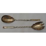 A pair of hallmarked silver servers, twisted stems with scroll terminals, Birmingham 1901