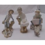 Three Lladro figurines to include a clown, a shepherd and a young boy, tallest 21cm (h)
