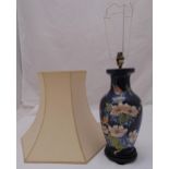 A blue ground baluster vase decorated with flowers, leaves, birds and butterflies, converted to a
