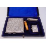 A cased hallmarked silver smokers set to include a cigarette case, a vesta case, a cheroot holder