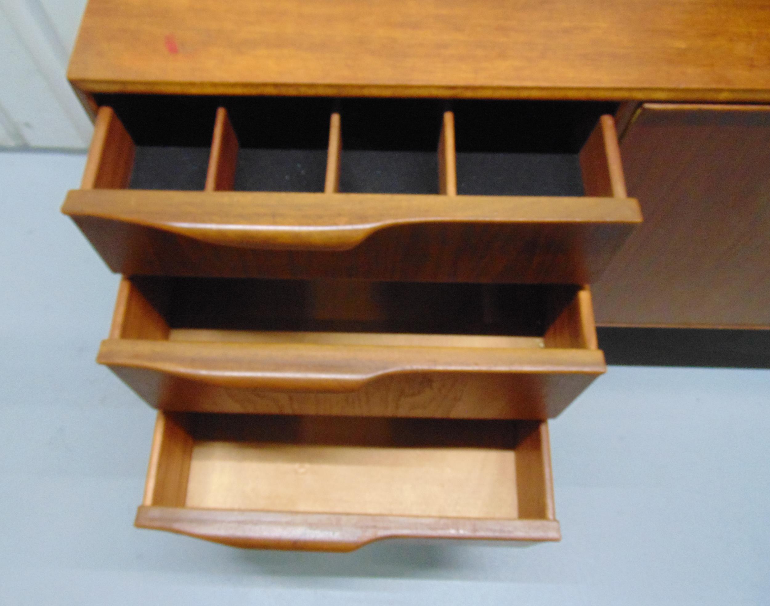 A mid 20th century McIntosh rectangular teak sideboard with cupboards and three drawers on - Image 3 of 4