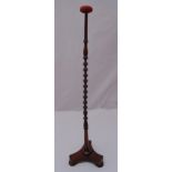 A turned mahogany milliners hat stand on triform base with three bun feet, 92cm (h)