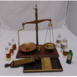 A quantity of pharmaceutical collectables to include a Stuart pill roller, an Avery balance scale