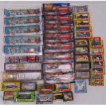 A quantity of diecast to include Corgi, Dinky, cars, buses and trucks, all in original packaging (