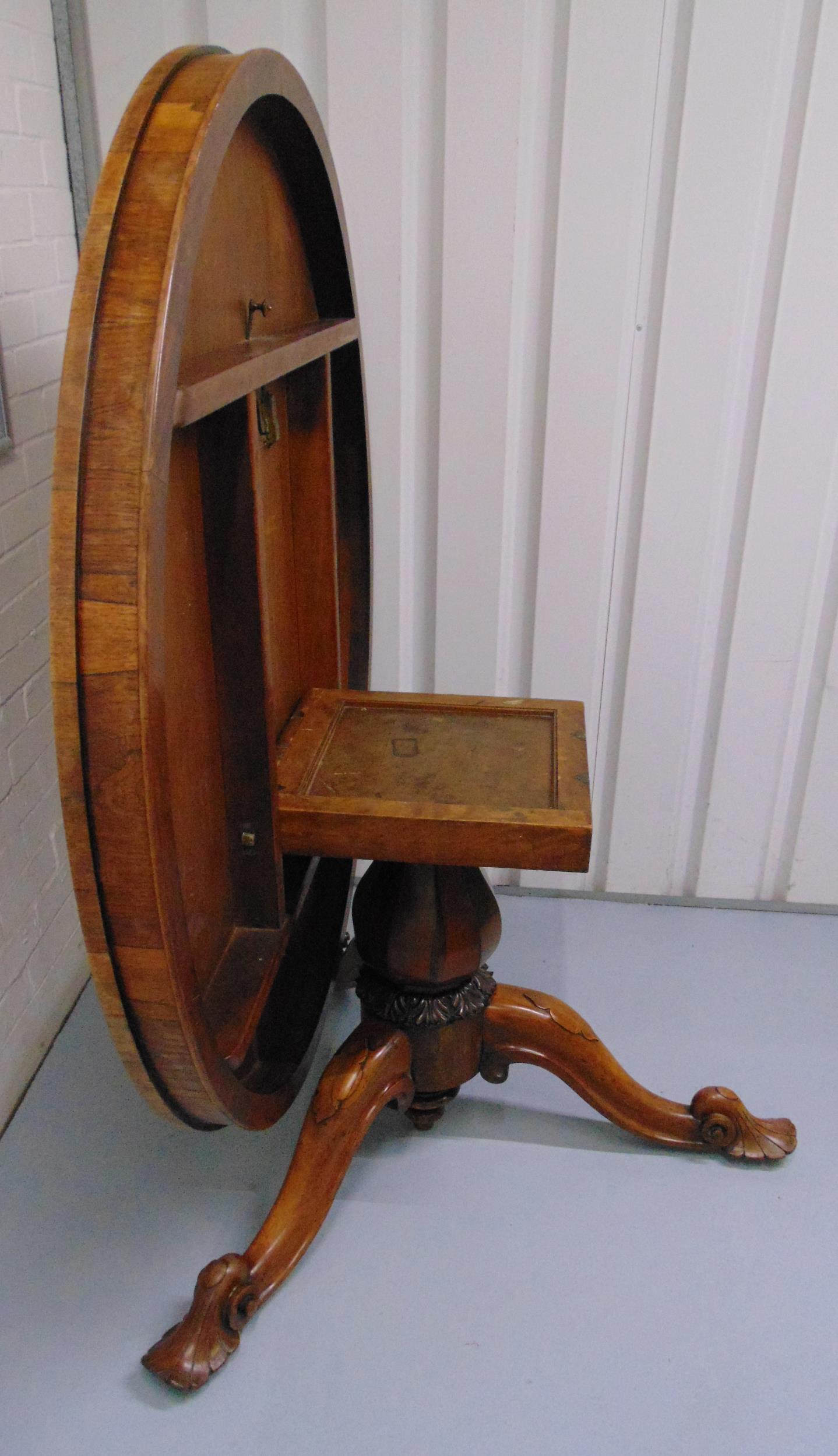 A Victorian mahogany circular tilt top table on three outswept scroll legs, 73 x 137cm - Image 2 of 2