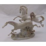 Lladro figural group of galloping horses on oval naturalistic base, marks to the base, 29 x 36 x