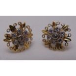 A pair of yellow gold and white stone floral shaped earrings, tested 9ct, approx total weight 3.6g
