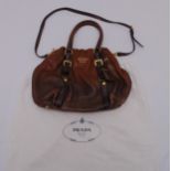 A Prada ladies brown leather handbag with gilt metal fittings A/F
