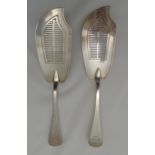 A pair of Victorian hallmarked silver fish slices with bar pierced blades, London 1854 by William