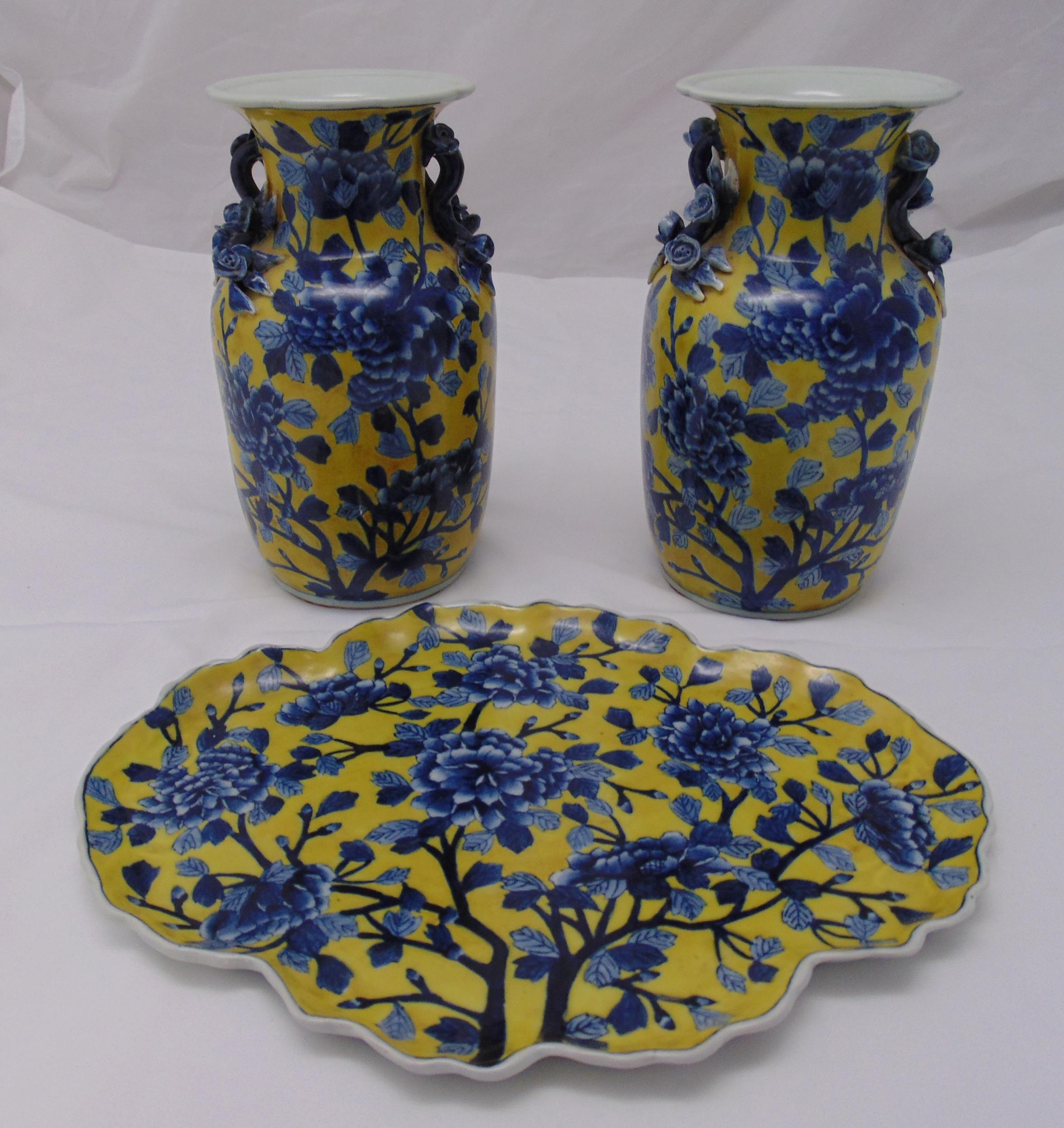 A pair of early 20th century Chinese baluster vases yellow ground decorated with blue flowers and