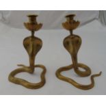 A pair of Indian brass candlesticks in the form of King Cobras, 22cm (h)